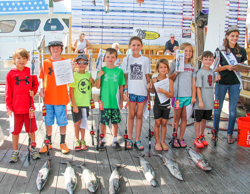 Kids weighing in fish at the Destin Fishing Rodeo