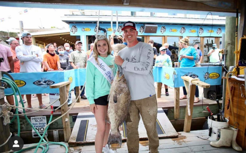 Weighing in with Miss Destin at the Fishing Rodeo