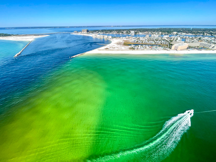 view of destin and east pass from parasailing boat